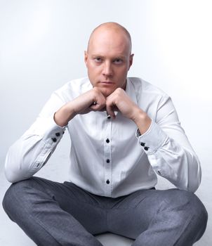portrait of middle age businessman in austere suit