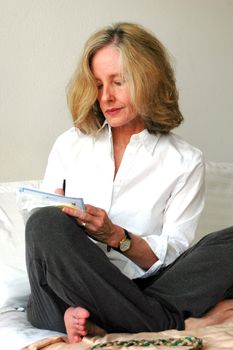 Mature female beauty working and relaxing at home.