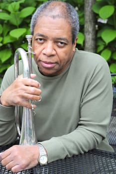 African american male jazz musician with his flugelhorn.