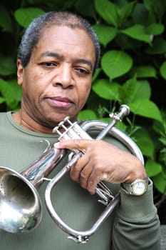 African american male jazz musician with his flugelhorn.