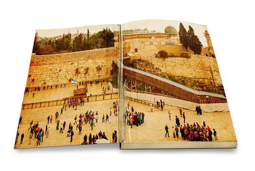 An opened old book with a picture Western Wall,Temple Mount, Jerusalem, Israel. Photo in old color image style on white background