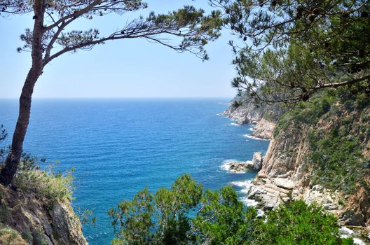 Mediterranean sea foam rocky shore under sky