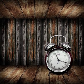 Alarm clock inside wooden cabinet