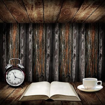 Time to read concept, Alarm clock beside open book with coffee cup