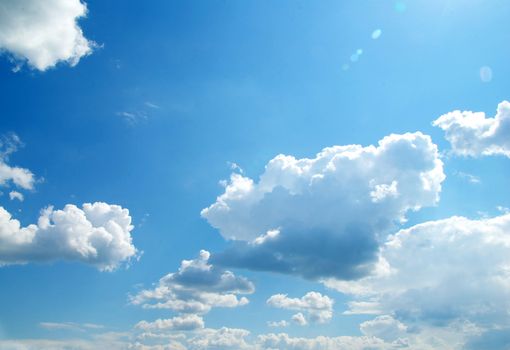 blue sky background with tiny clouds