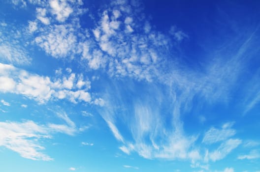 blue sky background with tiny clouds