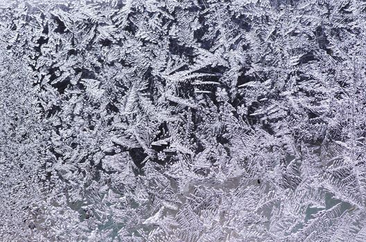 Frosty natural pattern on winter window