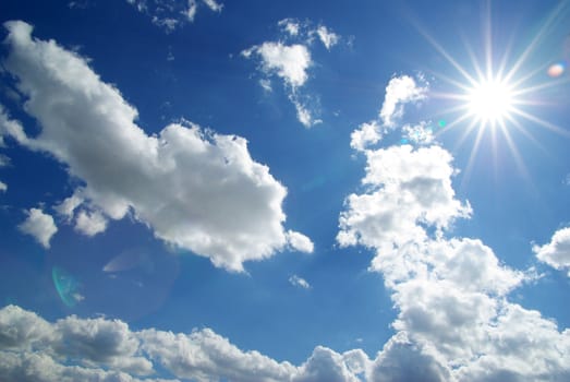 blue sky with clouds and sun
