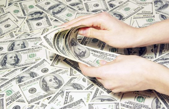 Hand with money isolated on money background