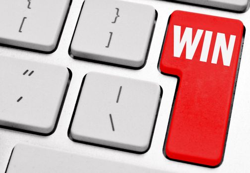 Win marked on a red computer return key 
