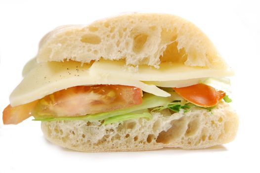 Closeup of a sliced ciabatta sandwich with mozzarella