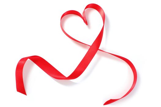 Red silk ribbon in the shape of heart