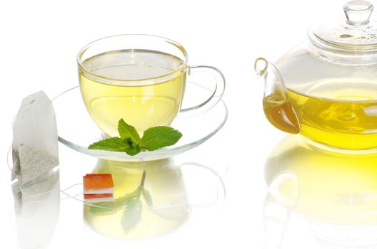Tea being poured into glass tea cup