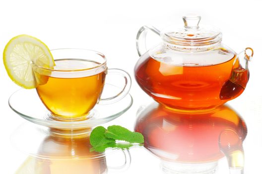 tea being poured into glass tea cup