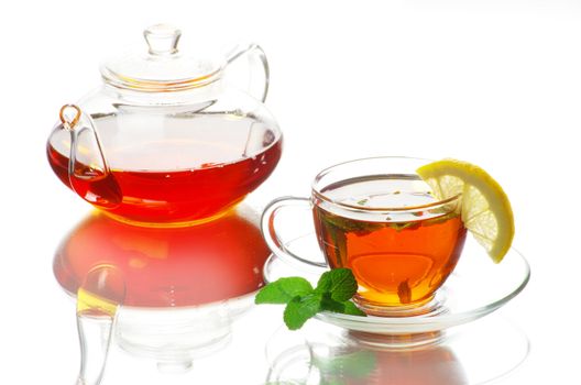 Tea being poured into glass tea cup