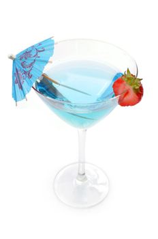 Blue cocktail with a slice strawberry and umbrella