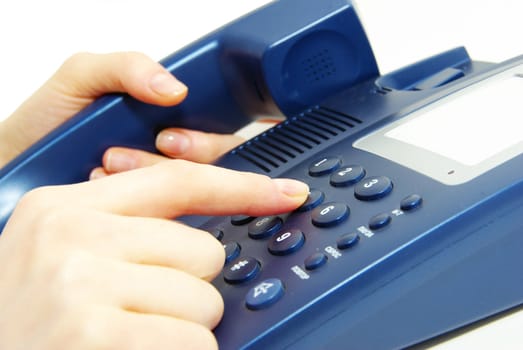 finger with  blue telephone keypad