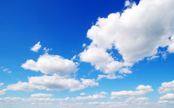 blue sky background with tiny clouds