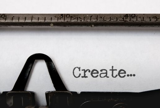 The word create written on a vintage typewriter