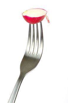 Radish on a fork isolated on white