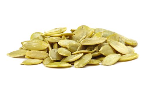 fresh pumpkin seeds isolated on a white