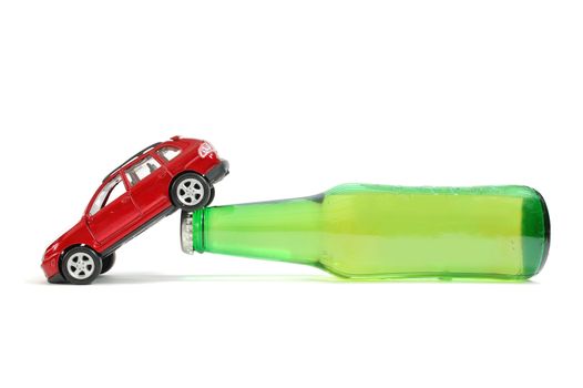 Toy car on a beer bottle