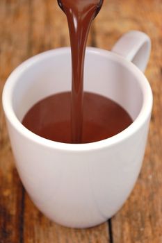 Hot chocolate being poured into a cup