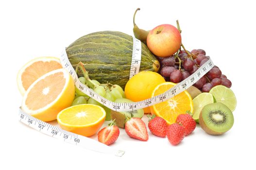 Tape measure around various types of fresh fruit 