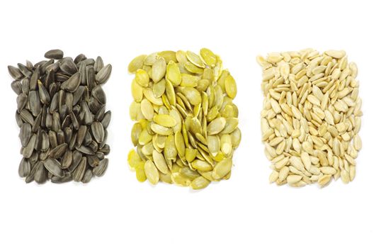  sunflower and pumpkin seeds on white