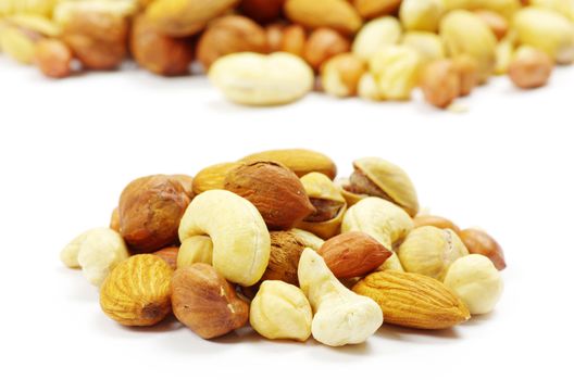 Assorted mixed nuts on white background