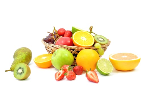 Various types of fruit inside and around a basket 