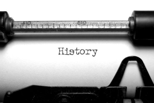 Close up of the word history typed on an old typewriter in black and white