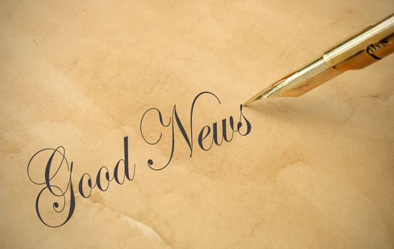 The words good news written with a vintage fountain pen
