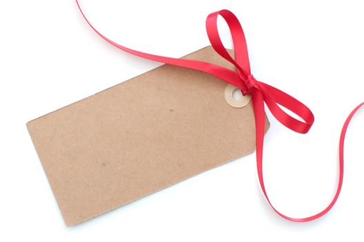 Blank gift tag with a red satin ribbon bow 