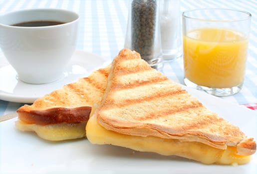 Toasted cheese sandwich with coffee