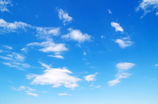 blue sky background with tiny clouds