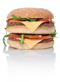 Double cheeseburger with tomatoes and lettuce  