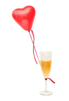 Helium air balloon tied to a glass of champagne over a white background