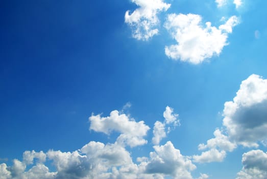 blue sky background with tiny clouds