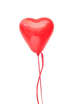 Red heart shaped floating air balloon over a white background