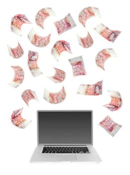 Fifty pound banknotes falling over a laptop computer 