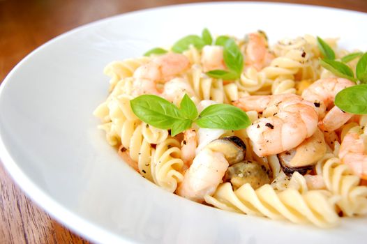 Delicious pasta seafood dish with basil