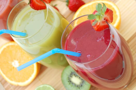 Fresh smoothies in a glass with a strawberry