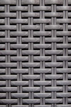 Black wooden striped textured basket weaving background. 