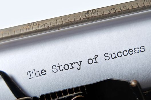 The typed title Story of Success on an old typewriter