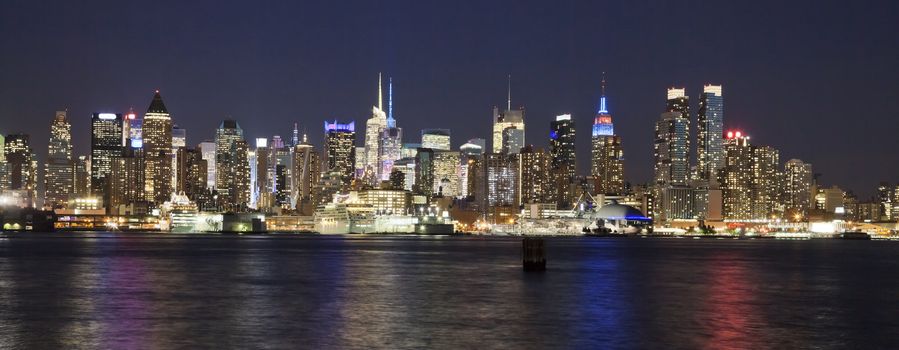 The New York City Uptown w Intrepid sea, air and space museum in the night