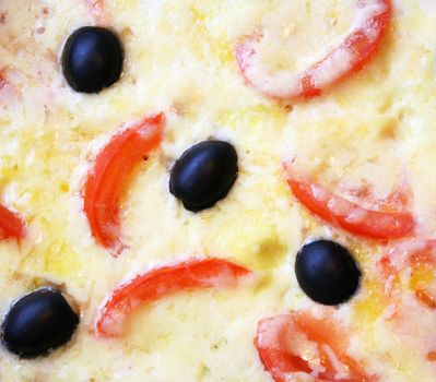 Omelette with tomatoes, black olives and cheese 