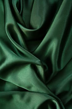 Smooth elegant dark green silk can use as background 
