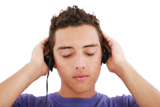 Boy listening to the music, isolated on white