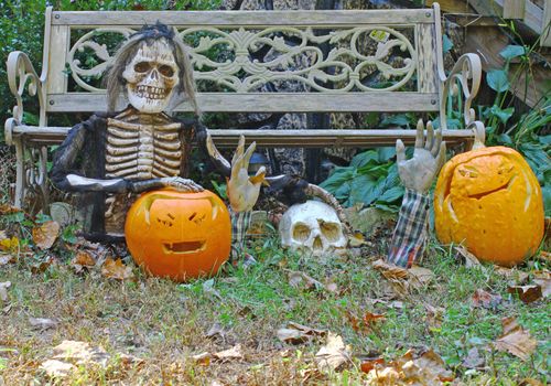 A seasonal Halloween design using a skull pumpkins and a ghoul with room for your text